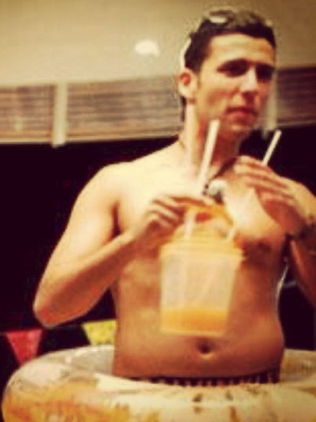 Old image of Coach Turker with a cocktail